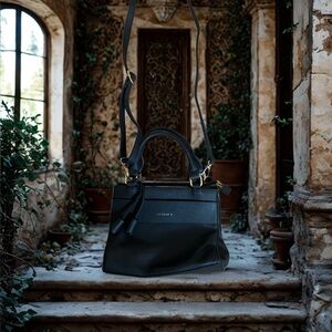 Gussaci Black leather shoulder bag with gold hardware and tassels